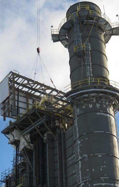 Industrial tower with scaffolding and rigging work